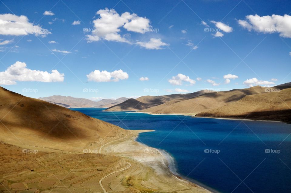 Blue lake between mountains in Tibet