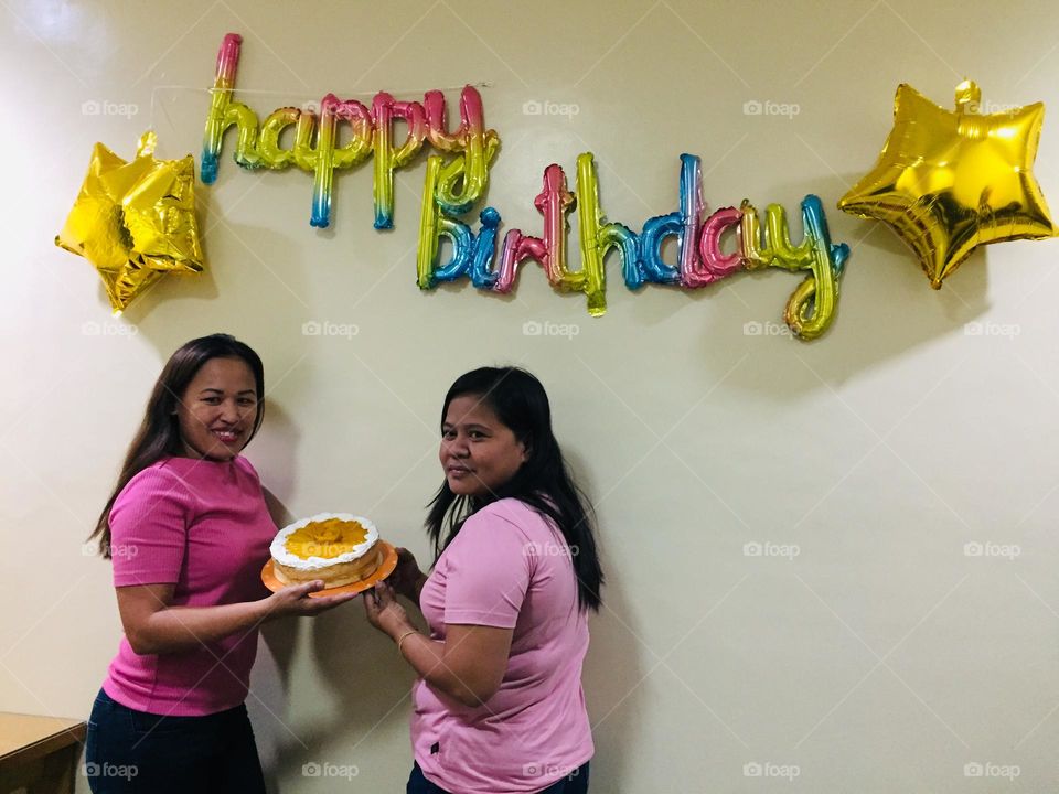Wearing pink on their birthday celebration 
