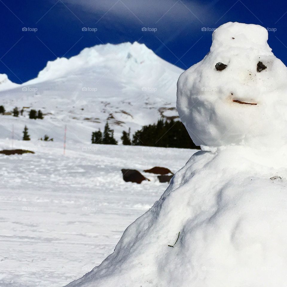 Snowman On Guard. Snowman guarding mountain