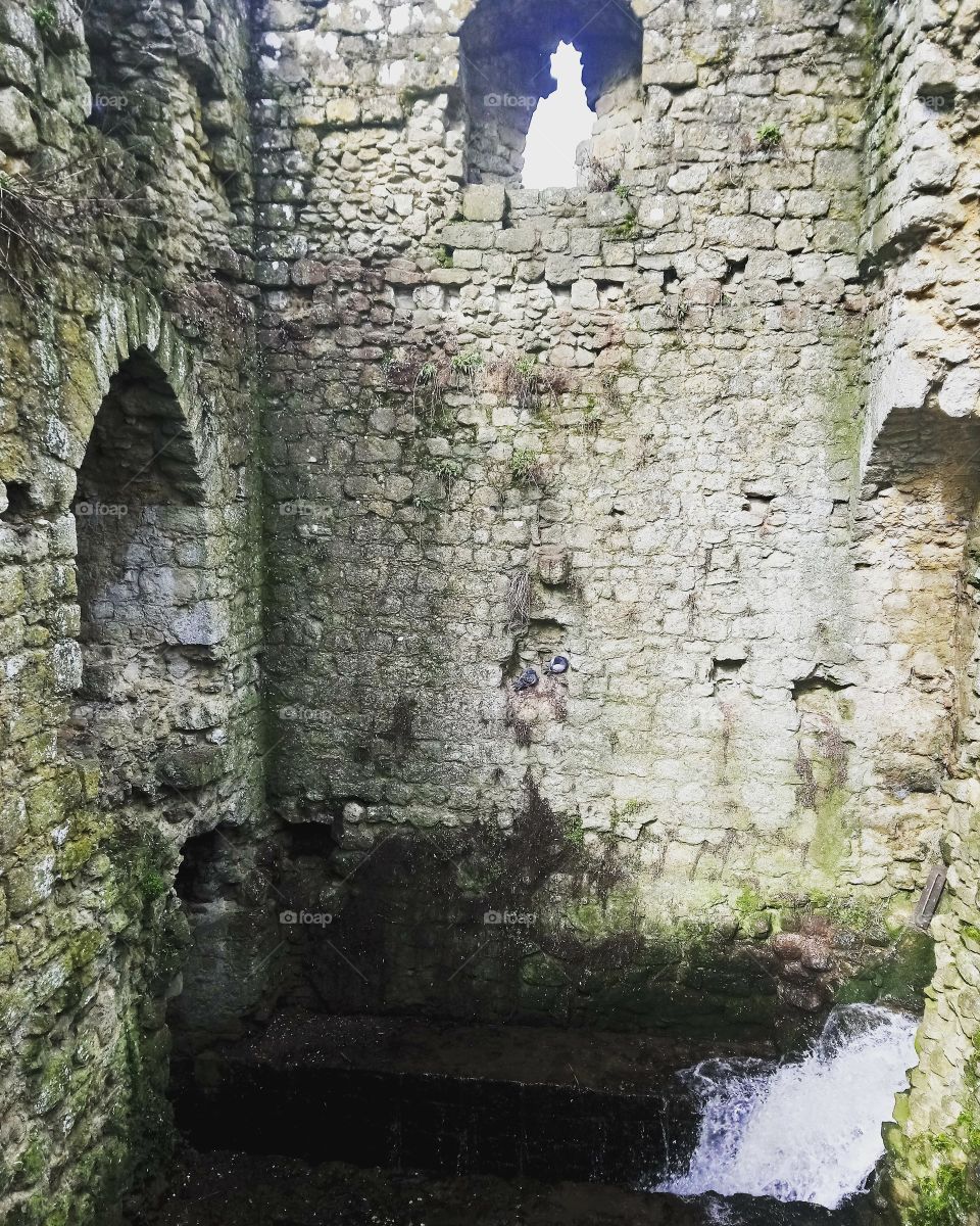 Water rushing through old ruins
