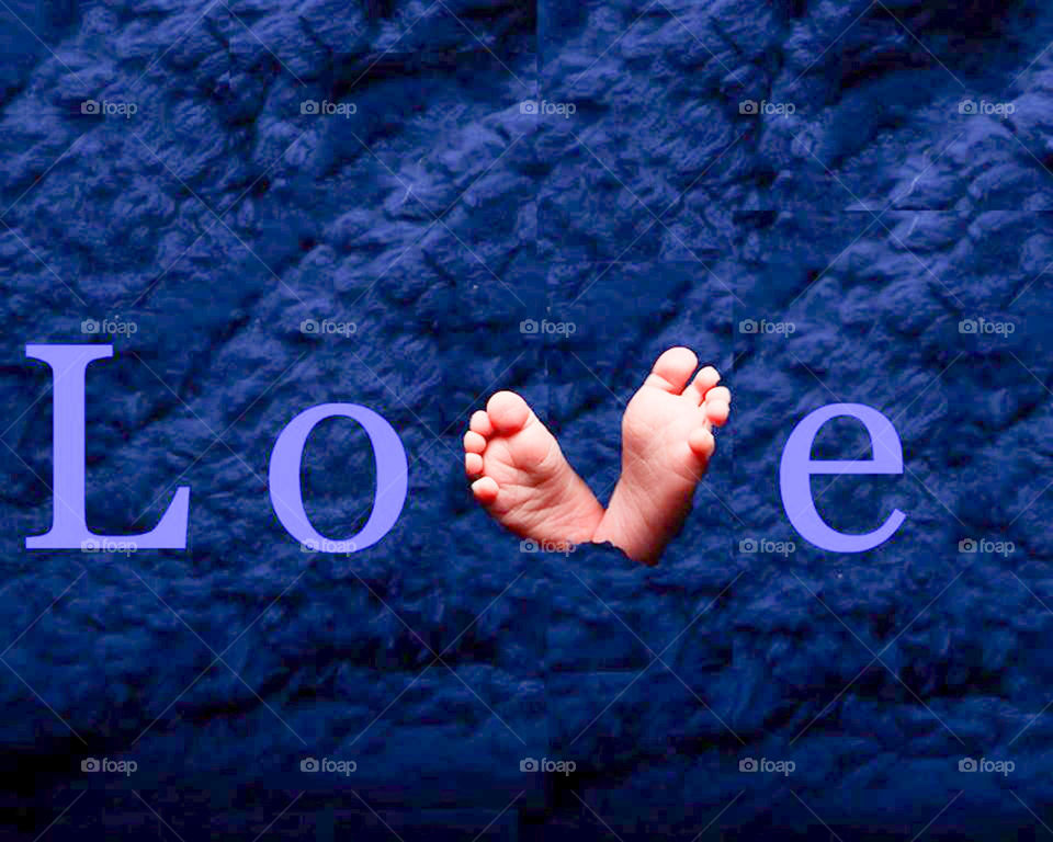 baby feet spell out love. love  newborn feet