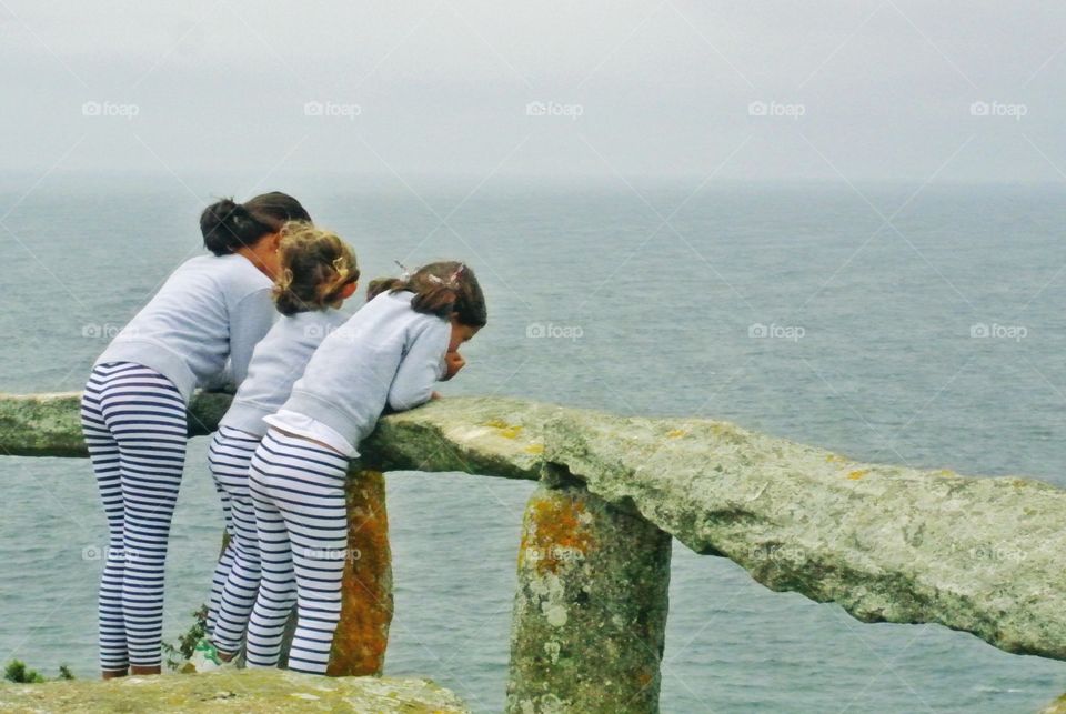 children at the top of the cliff