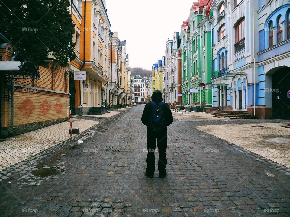 a man walking along the street in Kiev