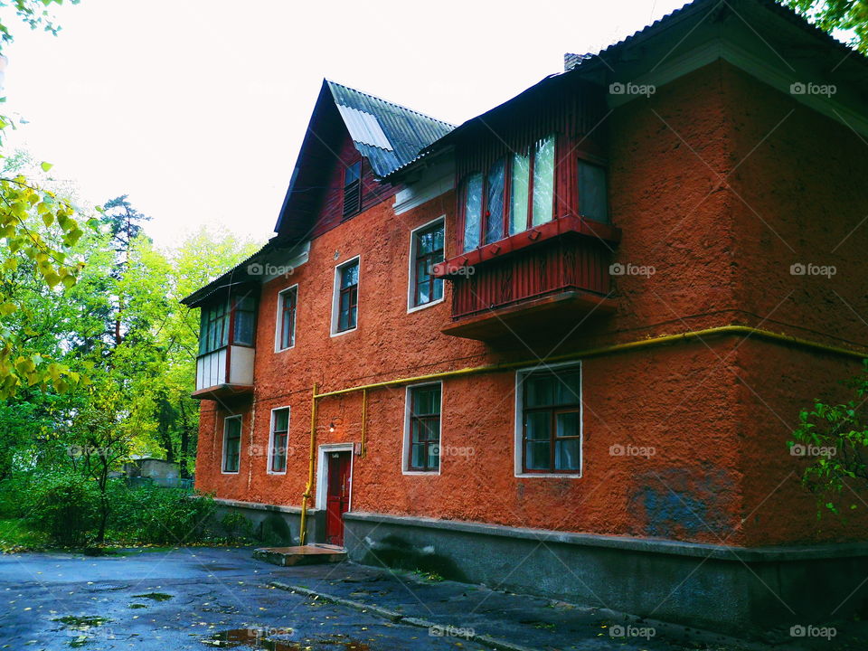 old residential building with a red facade