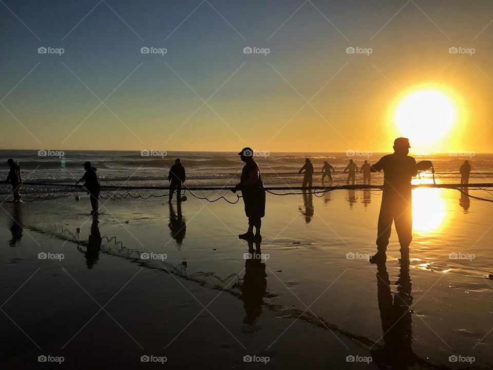 Fishing in Praia da Caparica, Portugal.