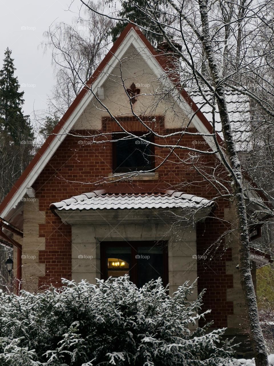 Romantic weekend house with warm light in window