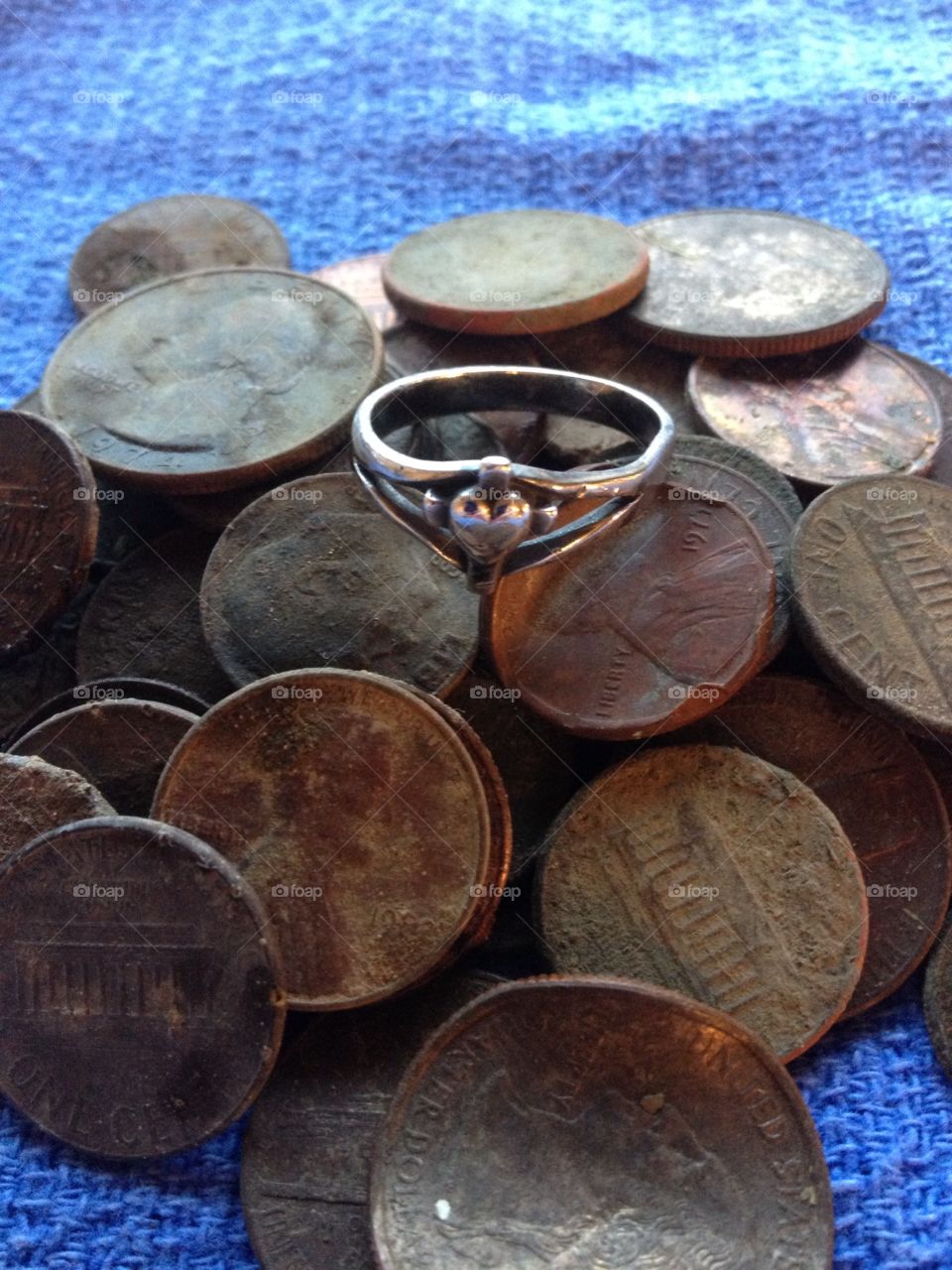 Lots of coins and a James Avery silver ring that were found while metal detecting in Texas. 