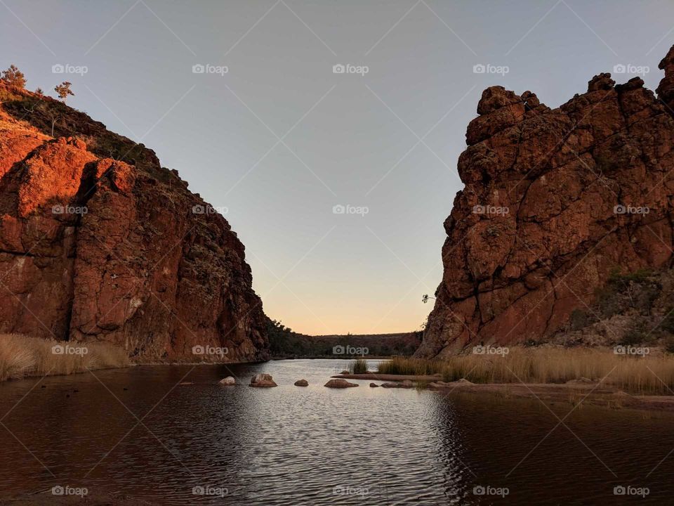 Sunset by the water's edge in the outback