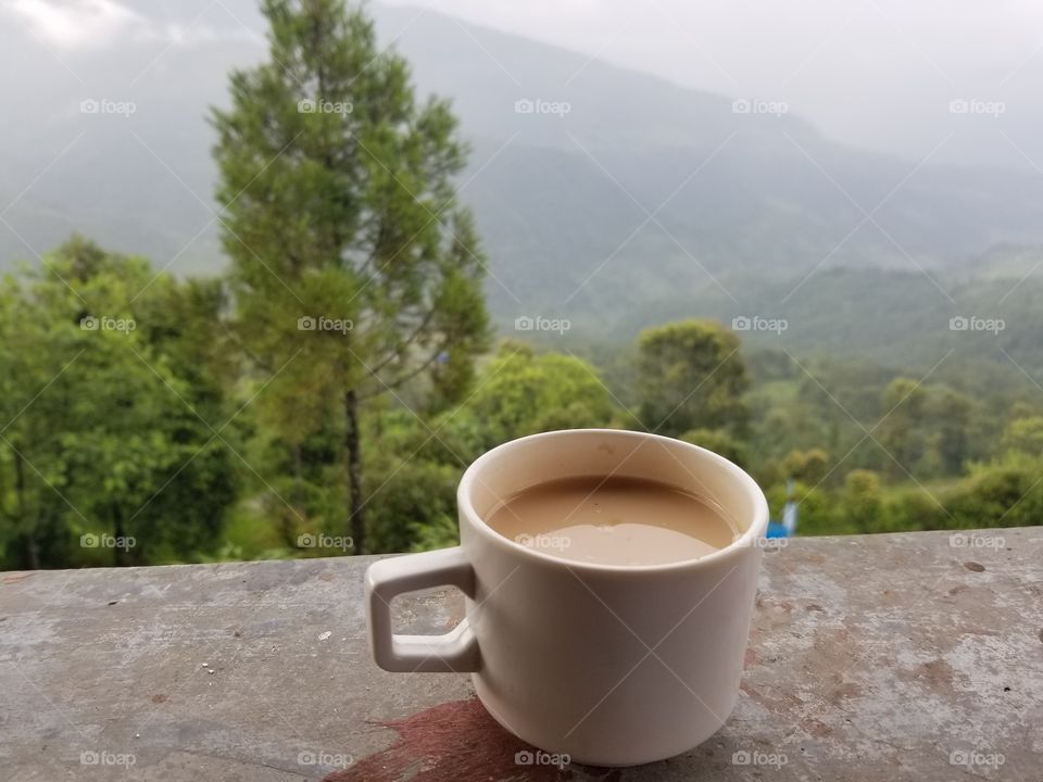 milk tea in nepal with view of himalayan mountains