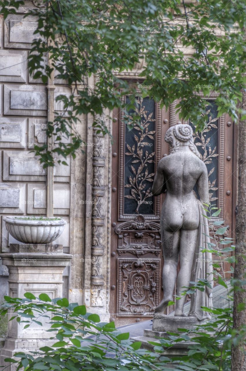 Entrance view with feminine statue of the Monterou Palace,Bucharest