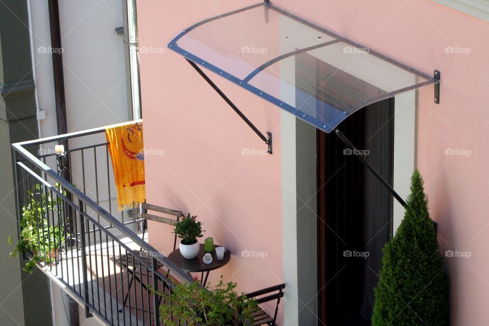 A nice balcony with a breakfast space in Italy.