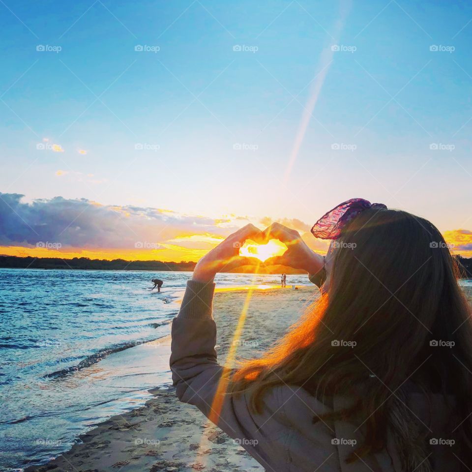 Sunset heart looking at the water