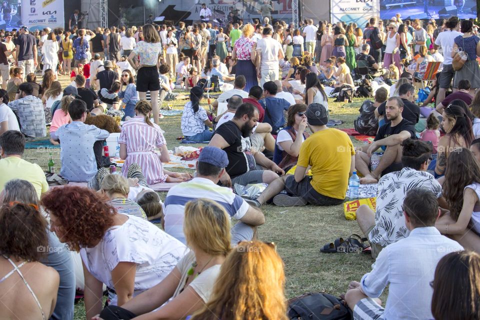 People on the grass at the summer outdoor concert