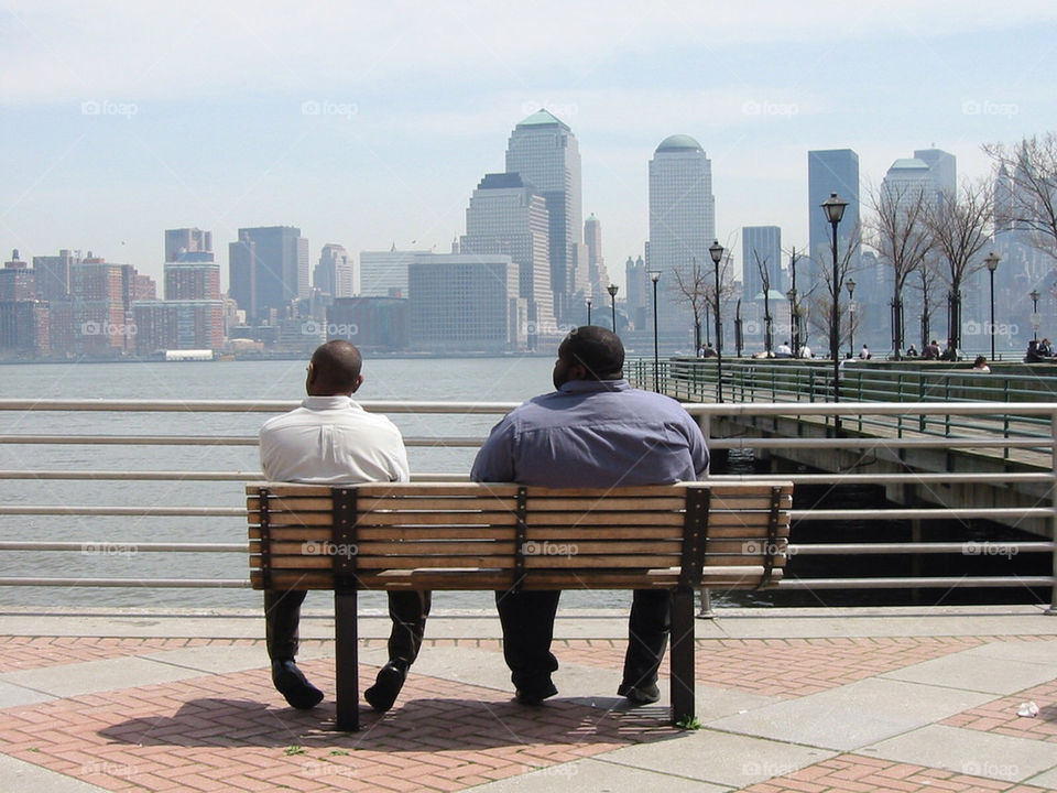 Men watching Manhattan skyline.