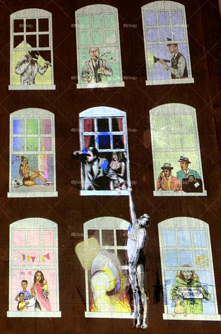 Banksy art display showing a story behind each window