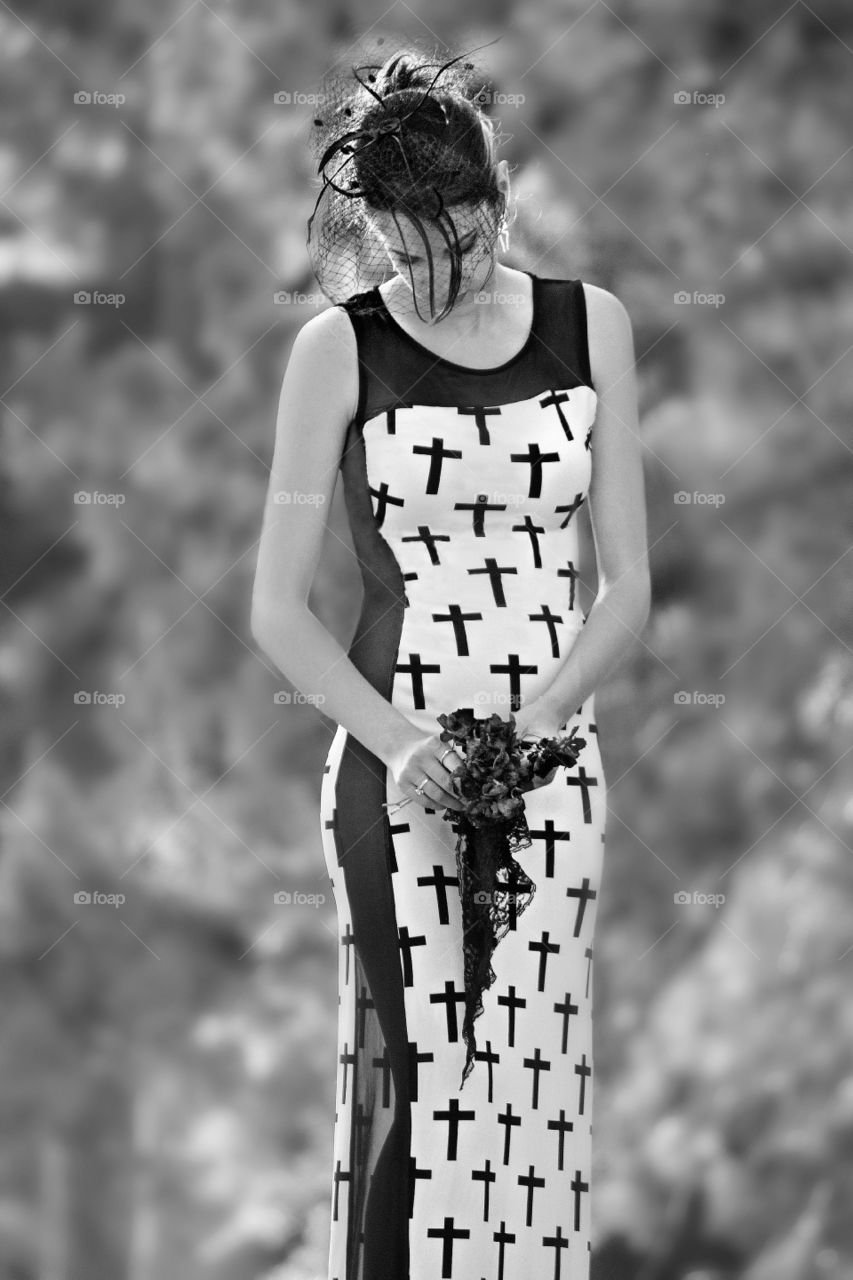 Beautiful woman standing with flower