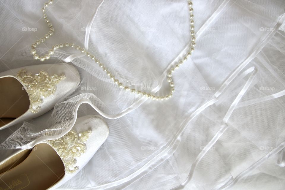 Wedding dress with shoes and pearl necklace