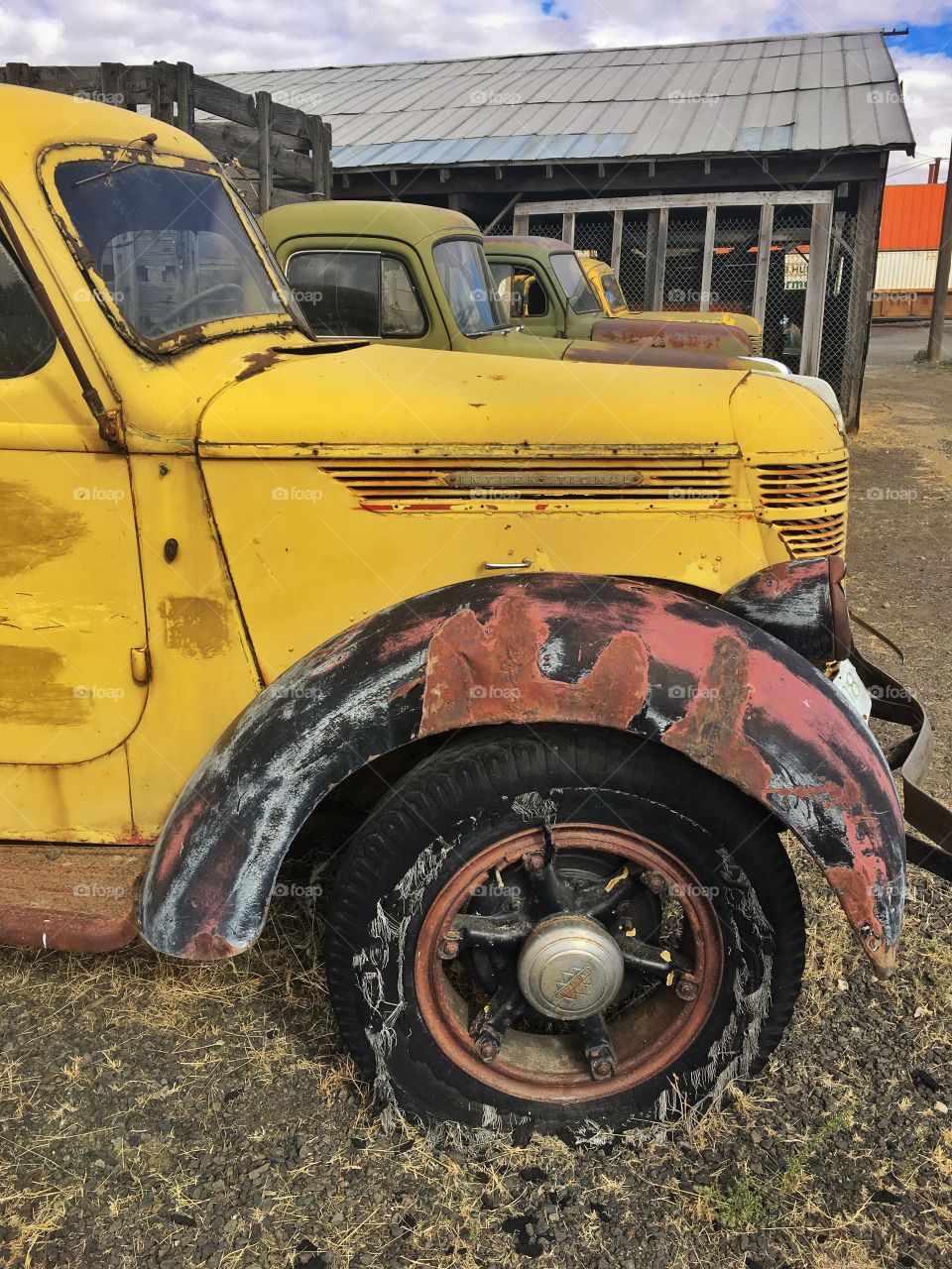 Old abandoned yellow vintage farm truck