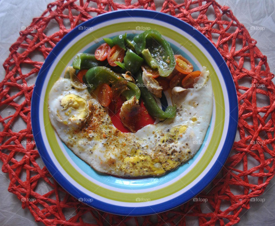 Eggs, green pepper and cherry tomato