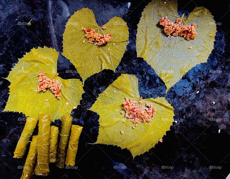 Making stuffed grape leaves 