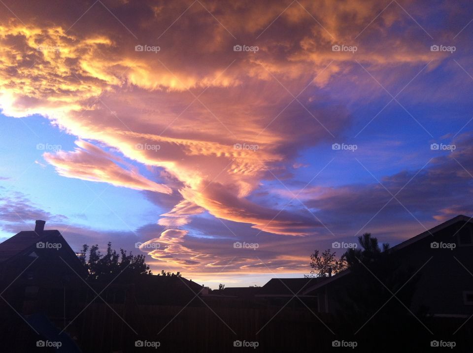 Sunset causing the clouds to be colorful