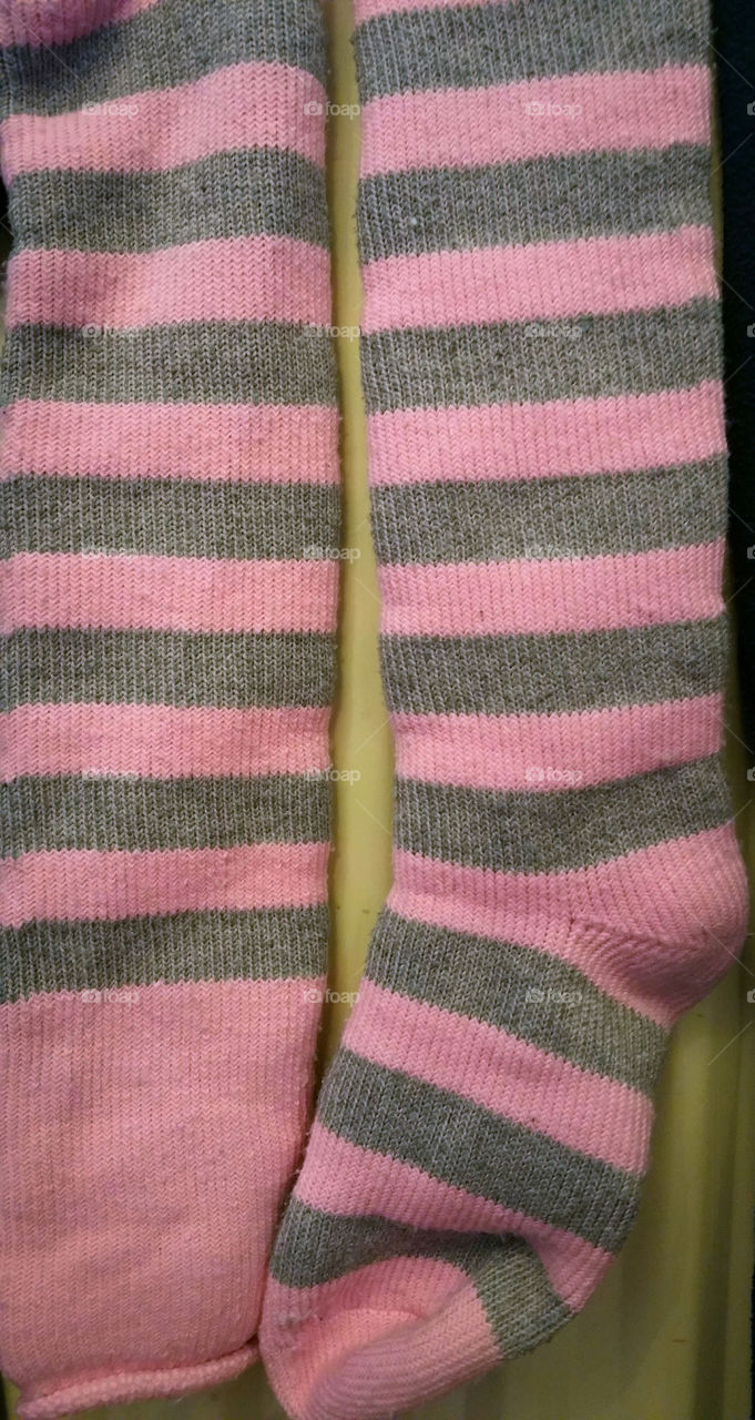 Pink socks on a radiator