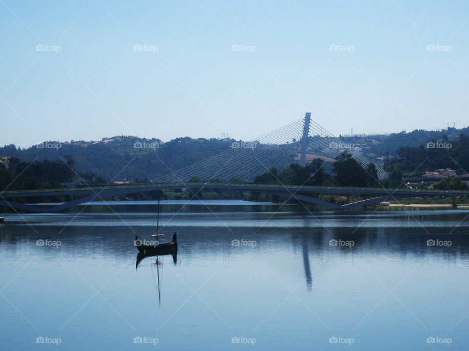 Bridge and boat in Coimbra in Portugal