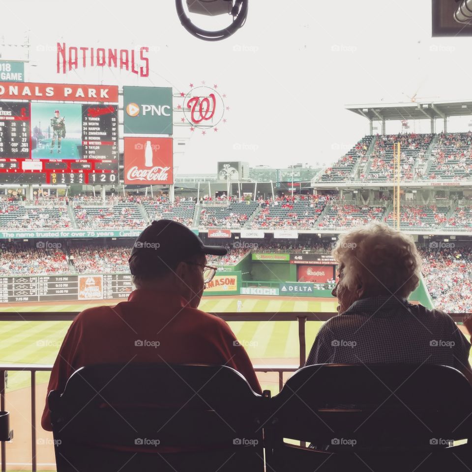 Older couple at baseball game