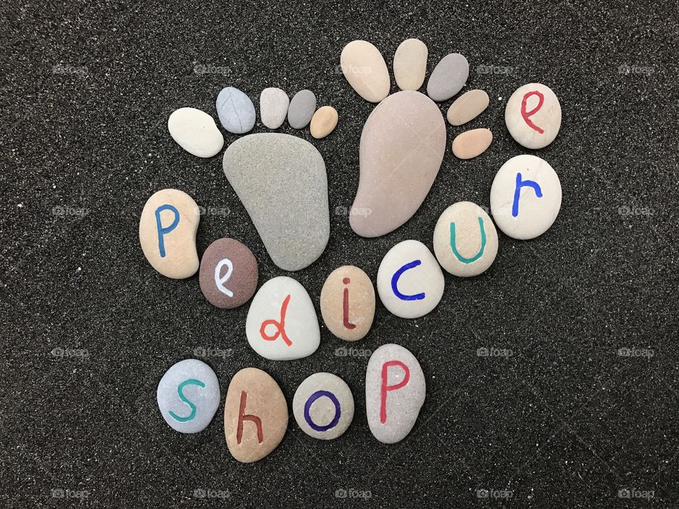 Pedicure shop sign with stones 