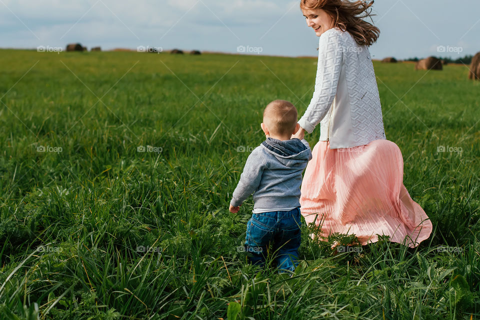 mom and son on the field