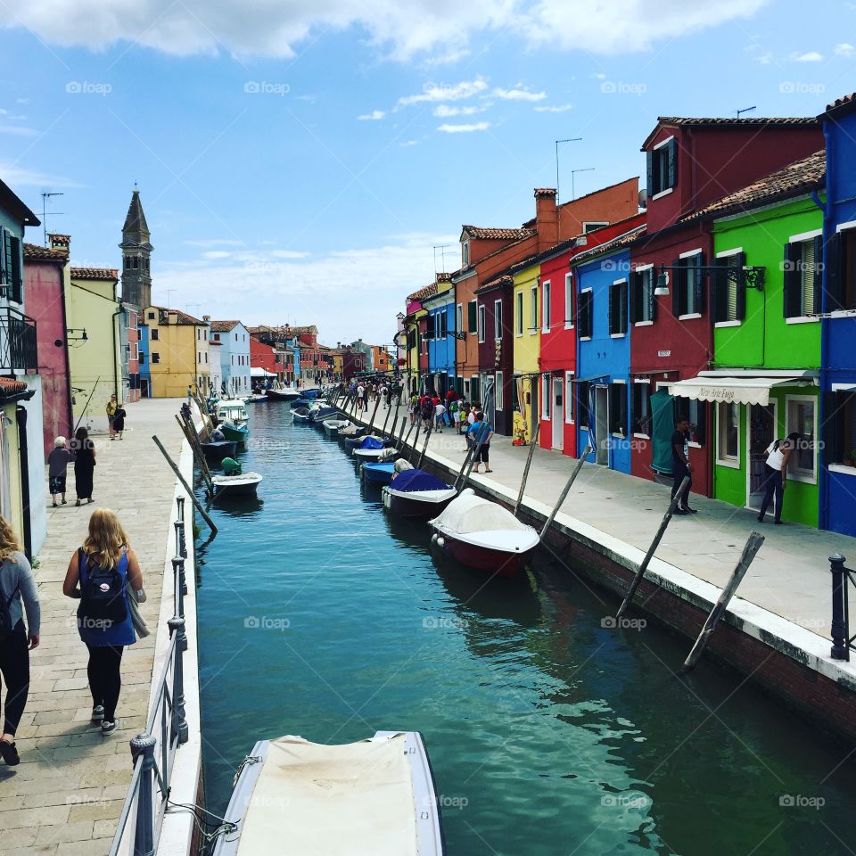 Canal in Burano. Exploring Burano, an island in the Venetian lagoon famous for its colourful houses,  and lace making.