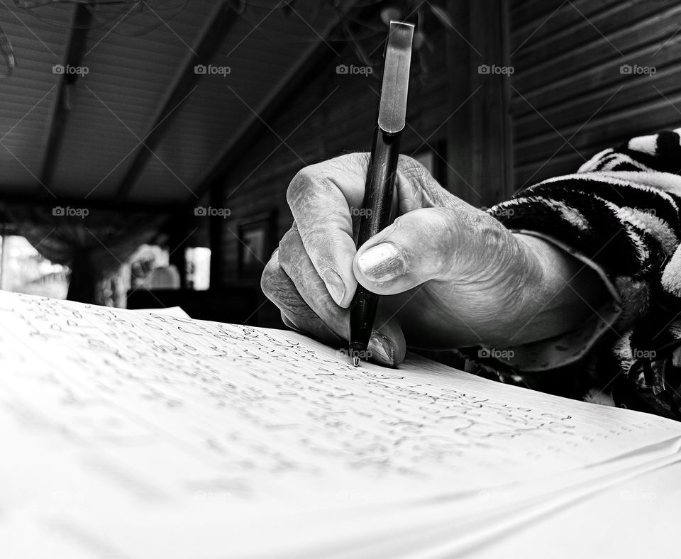 Old lady shaking hand writing