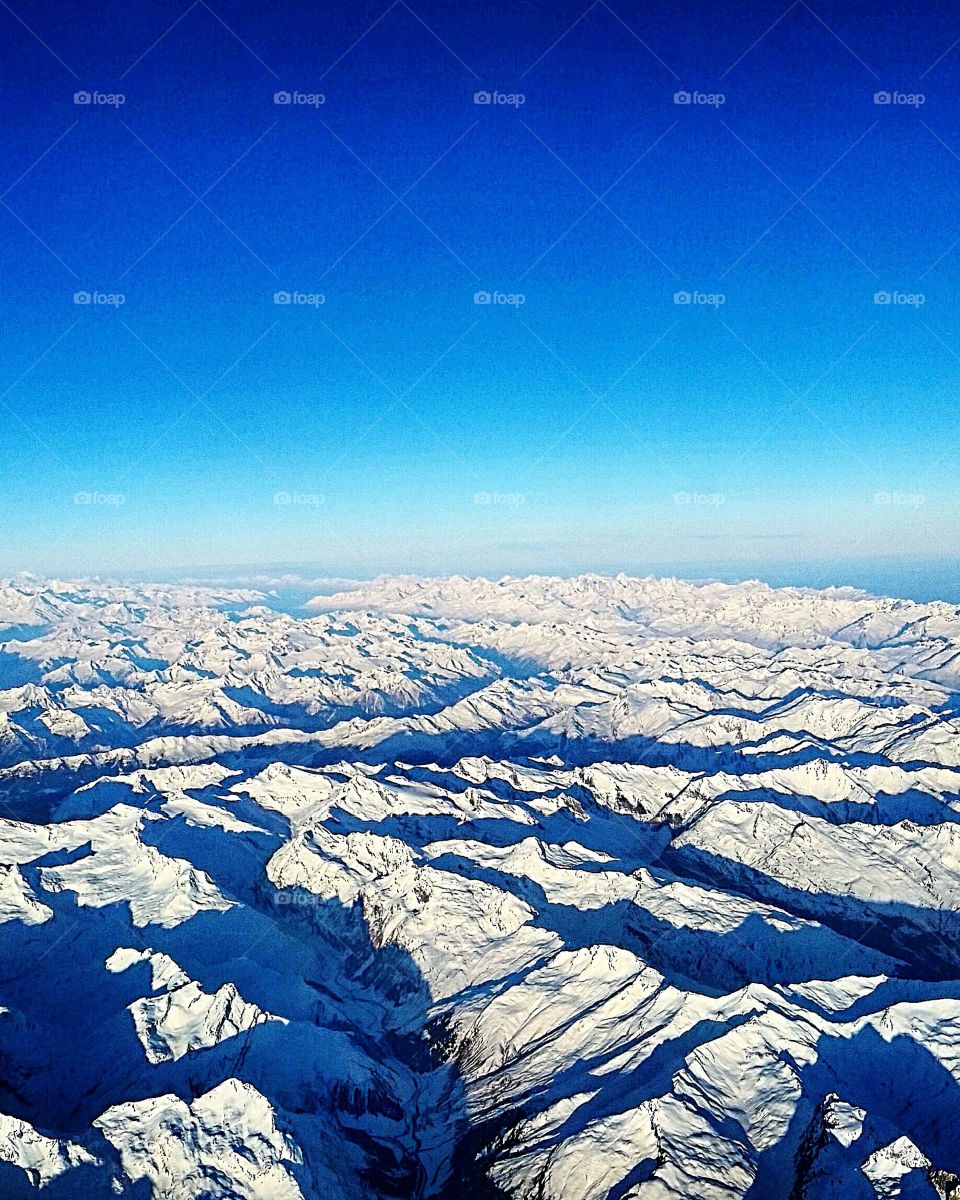 Aerial view of snow covered mountain range