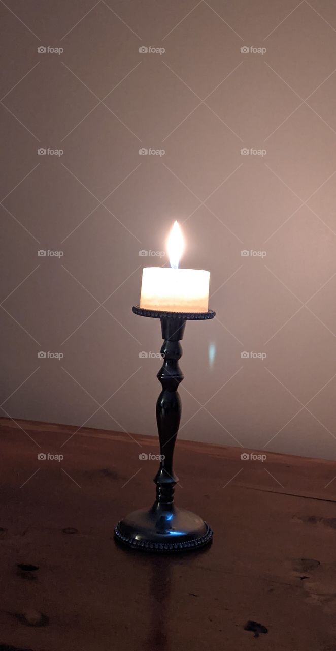 Single lit candle