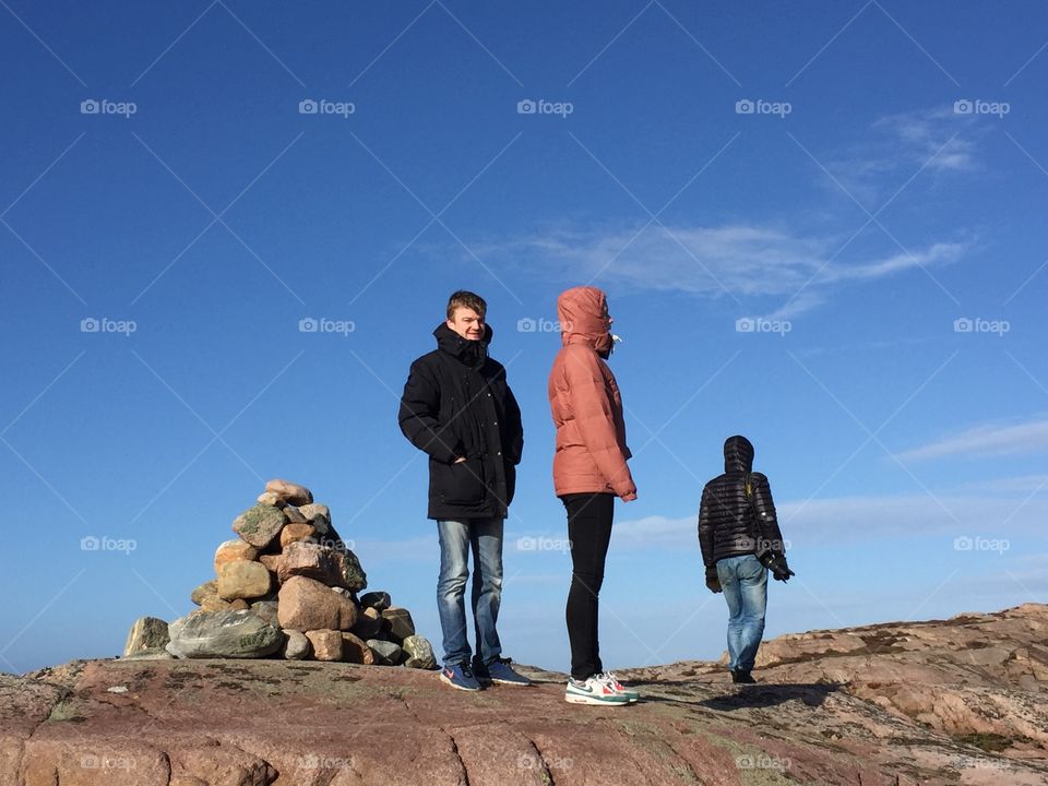 People standing on rocky mountain peak