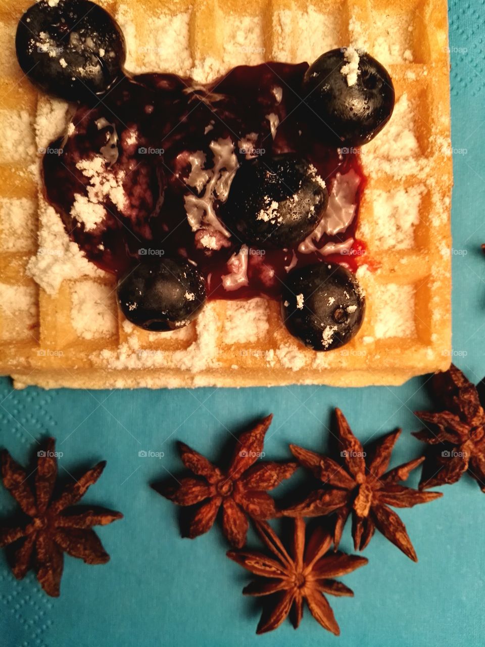 Healthy Christmas sweets with fruits, jam and dark chocolate on a rustic background