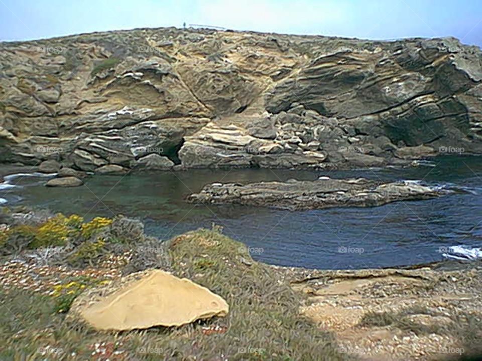 Water area surrounded by rock structure