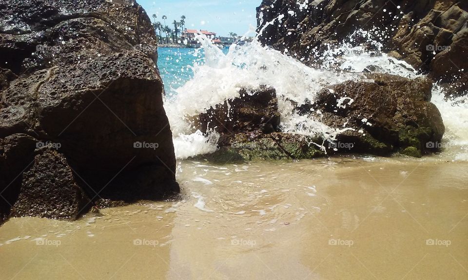 splash. waves splashing over the rocks