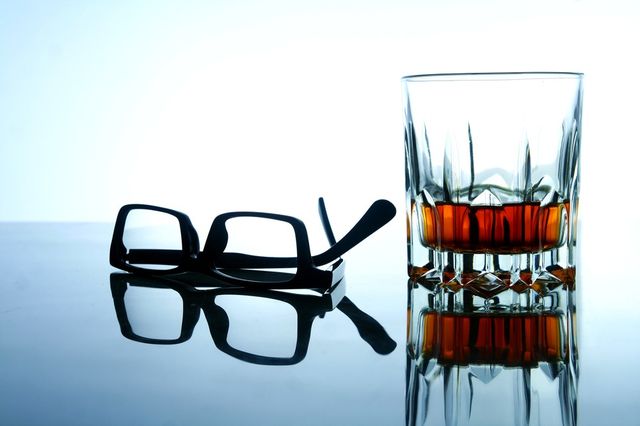 alcoholic drink and a pair of eyeglasses