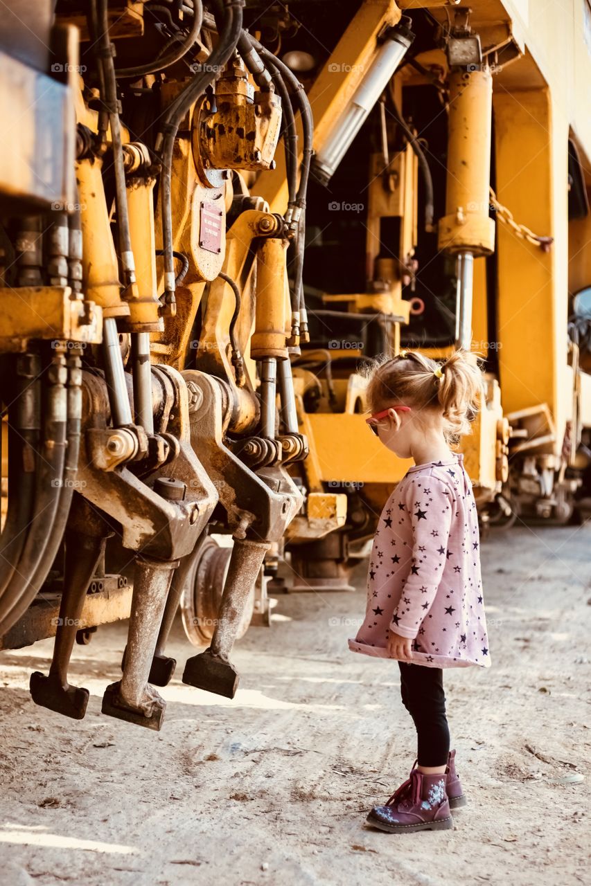Girl interesting at mechanical parts