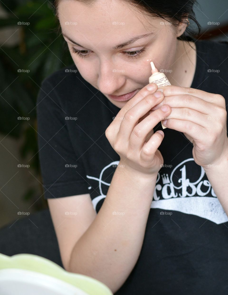 girl make up product in hands