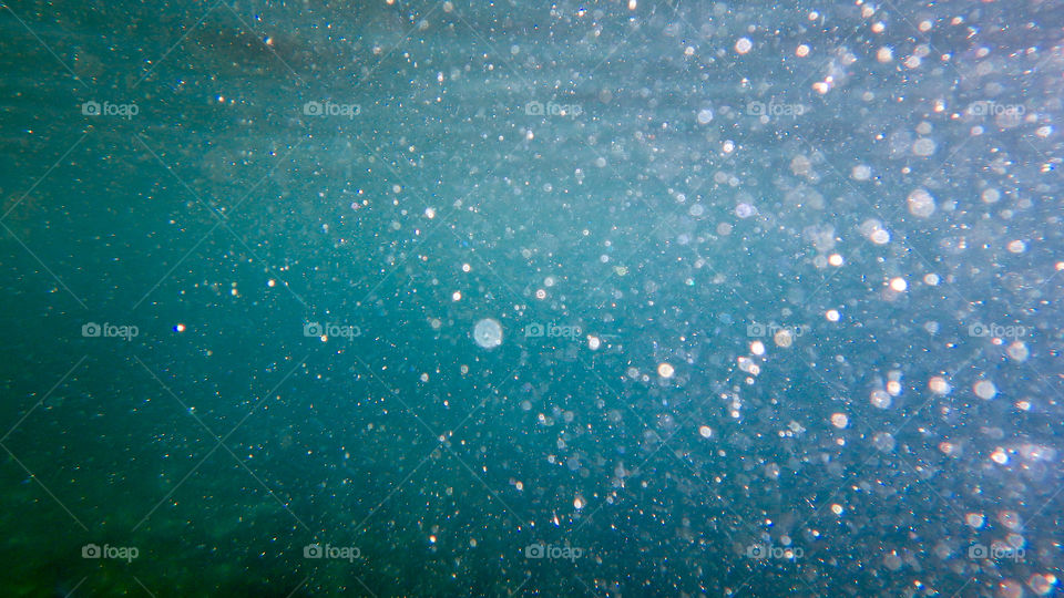 underwater photo big blue sea. bubbles in the sea