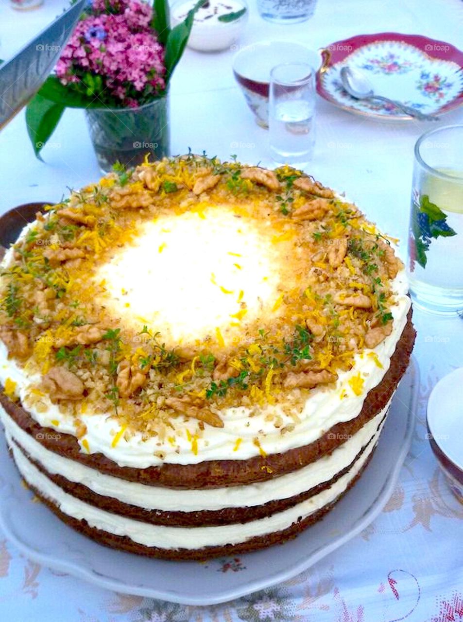 cake with nuts on the top and cream inside 