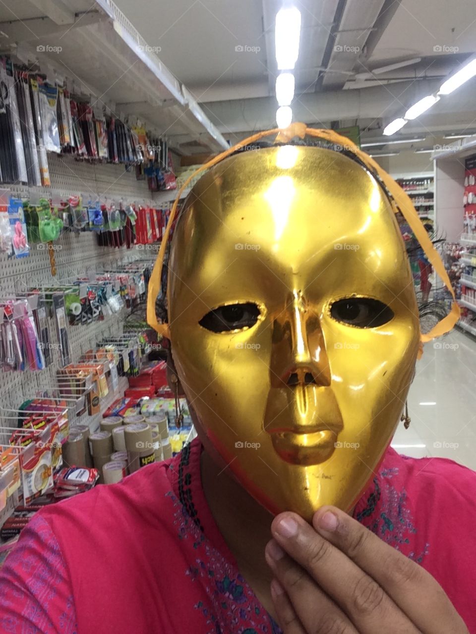Behind golden mask