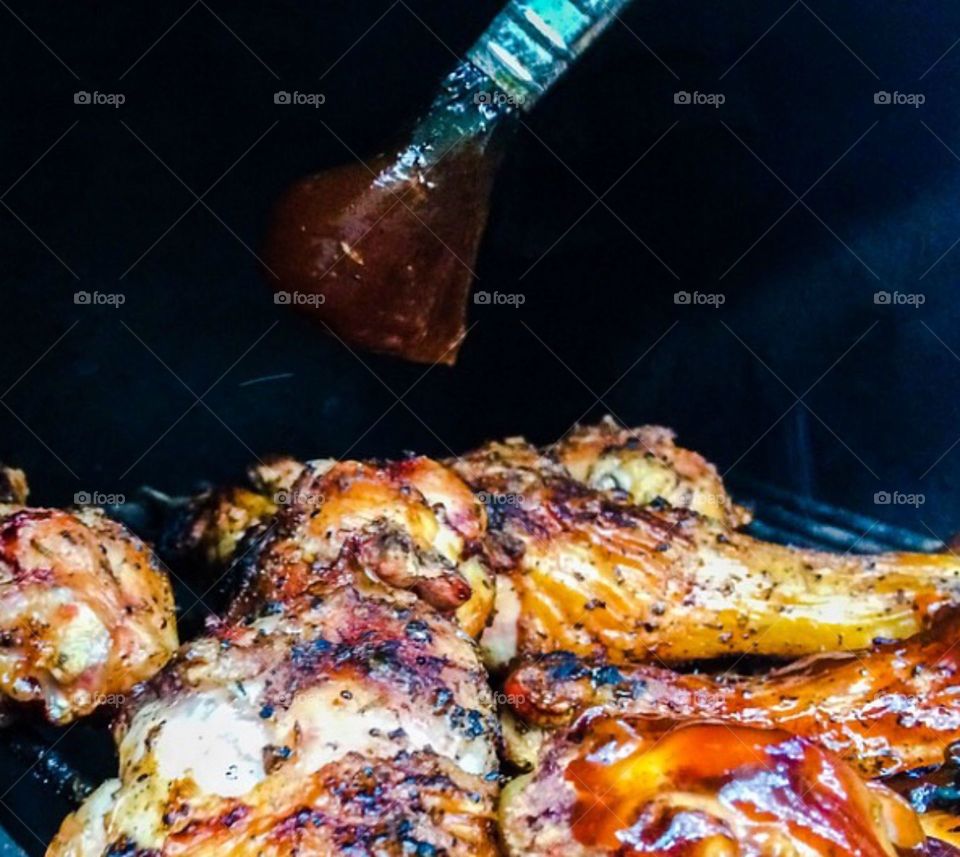 Cut barbecue chicken grilling with sweet honey barbecue sauce 