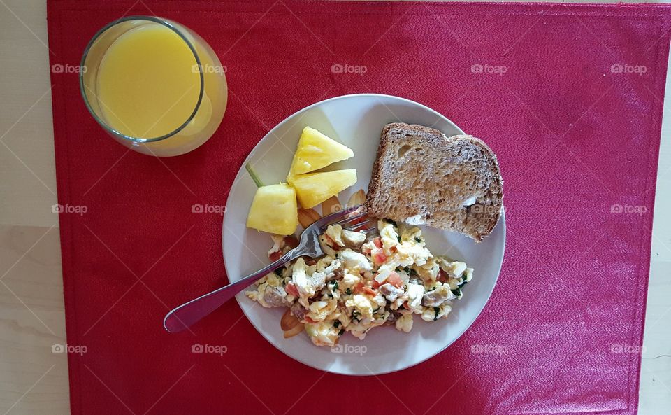 scrambled eggs. scrambled egg whites with spinach, sausage, onion, tomato, and cheese