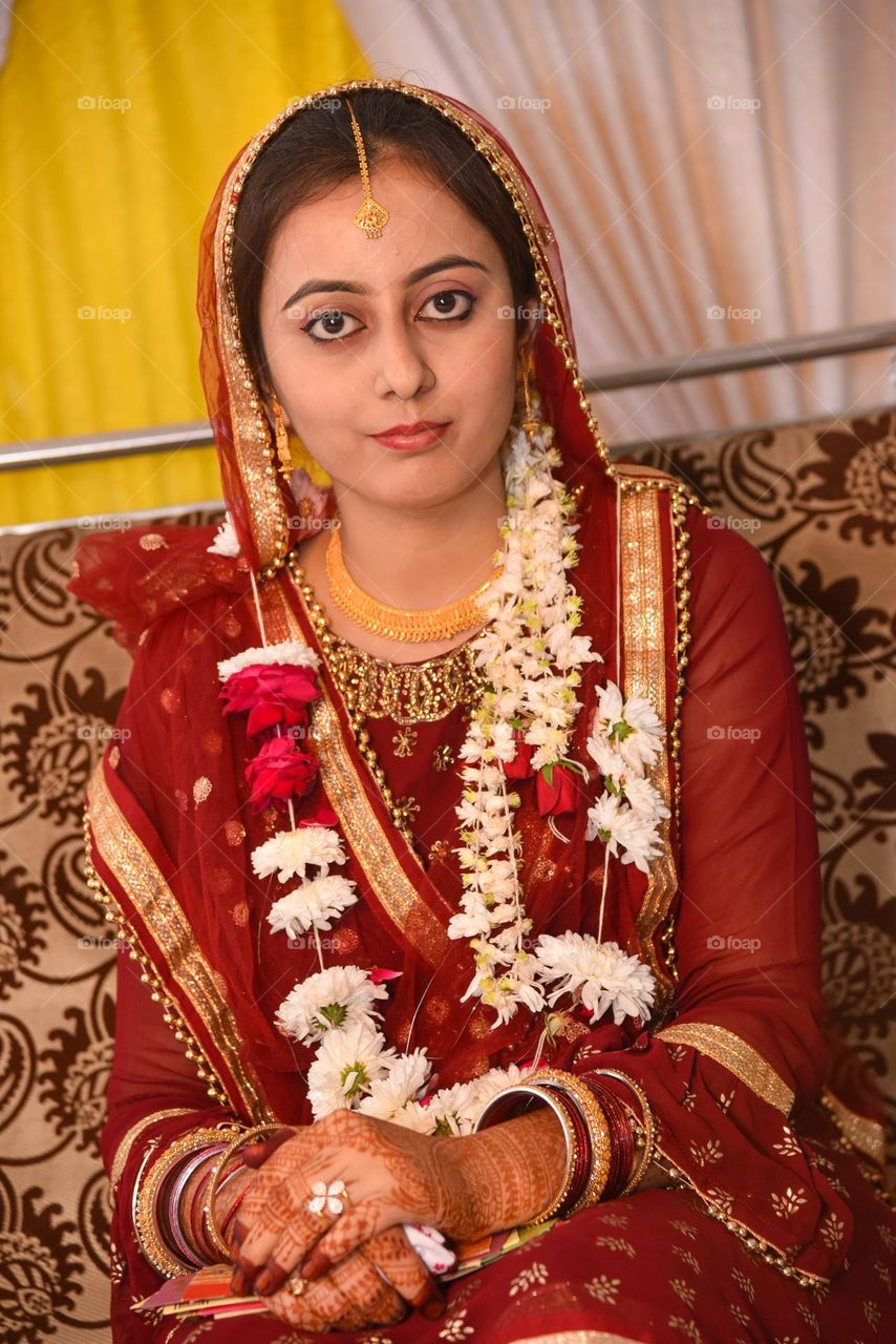 Portrait of a lady wearing heavy gold jewellery