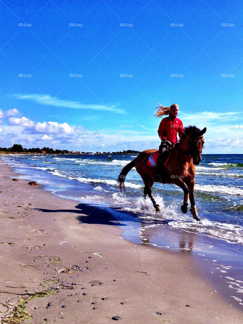 Riding along the beach