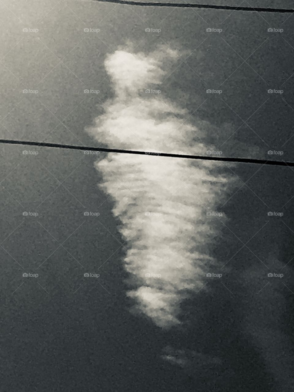 Skeleton mermaid clouds in the sky