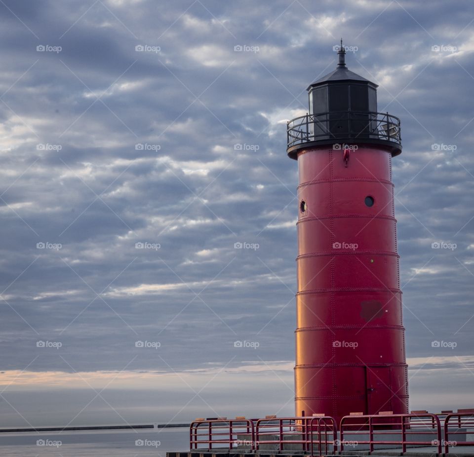 Sunset on Lake Michigan and Wisconsin with a red light house